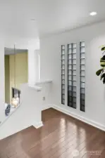 The landing on the upper level features Brazilian cherry hardwood floors and overlooks the entry of the home.