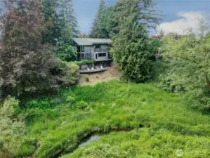 Drone photo back towards the home taken above the east side of Allen Creek.