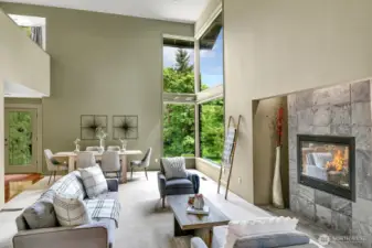 A gas fireplace with slate surround warms the formal living & dining areas of the home.