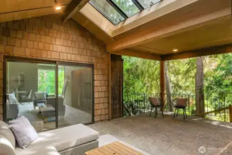 Vaulted ceilings, skylights and recessed lighting highlight the loggia, a unique indoor/outdoor living and entertaining space.