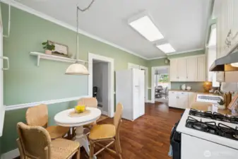 A spacious, modernized kitchen complements the home’s vintage allure, and an expansive unfinished 900 sq ft basement—with workbenches and a separate exterior entrance—offers room to grow or create.