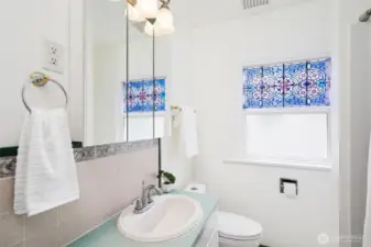 A recenlty updated bathroom with a new tub shower surround.
