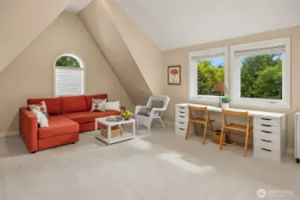 Bonus room with soaring cathedral ceilings, and a massive walk-in storage room.