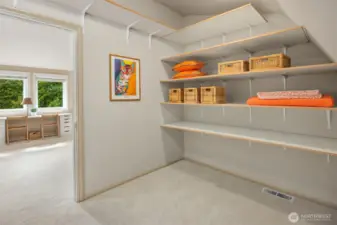 Huge storage closet in bonus room with shelving. This is a sweet surprise as you can stash away all of your seasonal decor in here when not in use, or store extra bedding, etc.