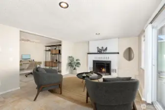 Lower level family room with access to the 2 car attached garage and 3/4 Bath.  Could easily be a home office with its own exterior access and lower parking area! Heated Flooring too!