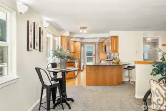 Breakfast bar fits 3 chairs for those quick meals with dining table area near the living room.