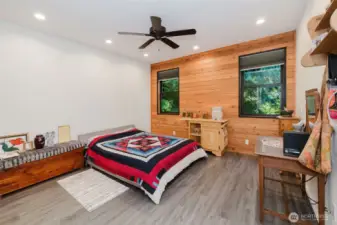 Primary bedroom - love the wood wall!