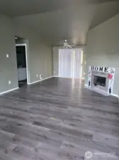 Vacant unit 1006. Vaulted ceilings in the living and dining areas create a bright, airy feel.