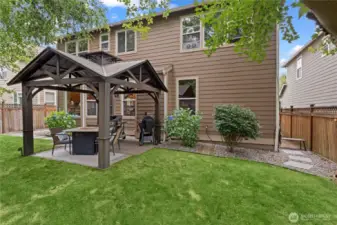 Tranquil Backyard Space with Gazebo and Firepit