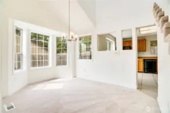 Seat a crowd or enjoy a solo meal in this formal dining space complete with new carpet, trim and paint. Note how easy this room flows to and from the kitchen.