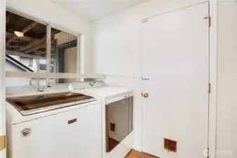 The laundry room leads into the garage and there is a deep sink and storage on the other side just outside of this view. The washer/dryer stay!