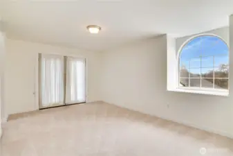The primary suite is a true retreat! New paint, trim and carpet complement the natural light brought in by the oversized window and French doors. There is also an ensuite bath and walk-in closet!