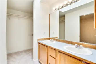 The primary ensuite features a double vanity, new carpet, paint and trim, and a generous walk-in closet!
