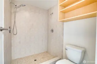 The tiled shower in the primary ensuite has dual shower heads to create a truly spa-like experience!