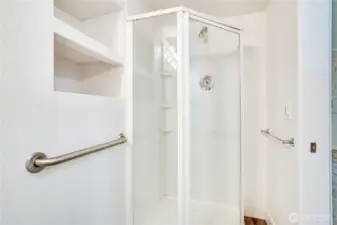 Here is the three-quarter shower and thoughtful built-in storage for towels, toiletries and more!