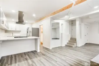 This photo shows the entrance to the main home garage just up those stairs. This added finished space is a fantastic opportunity for the next owner of this lovely home.