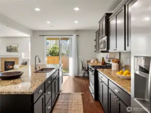 Bright kitchen with backyard access through sliding doors — ideal for everyday living and entertaining.