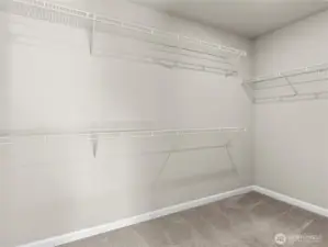 Oversized primary walk-in closet.