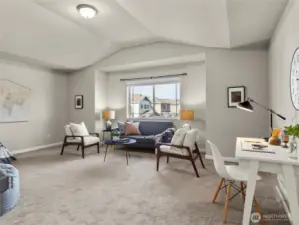 Spacious upstairs bonus room offers flexible living space — great for work, play, or relaxation.