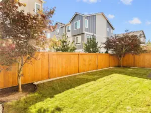 Fully fenced backyard with easy-care landscaping and room to enjoy the outdoors.