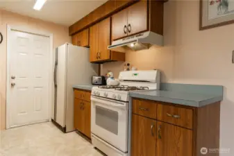 The closed door leads to the garage.