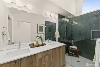 Expansive spa-inspired bath highlighted by sleek surfaces and a walk-in shower that exudes calm.