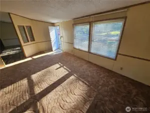 The Livingroom gets filled with natural light in this spacious area connected to the dining room.