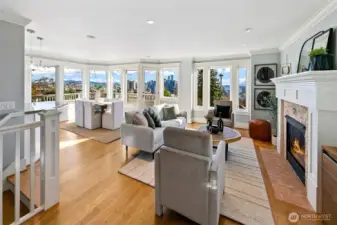 A panorama of view windows span the south side of this house. Views of Elliott Bay, Space Needle, and Downtown Seattle.