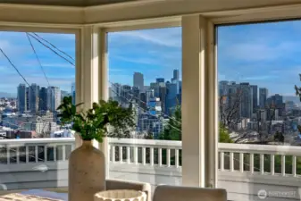 A panorama of view windows span the south side of this house. Views of Elliott Bay, Space Needle, and Downtown Seattle. BBQ Deck from the main floor and amazing deck from the top floor to take in the city.