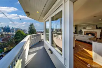 Great outdoor spaces include decks from living and primary suite, a low maintenance front yard and a ground level sunshine terrace.