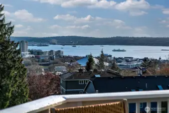 Big Views of Elliott Bay. Great outdoor spaces include decks from living and primary suite, a low maintenance front yard and a ground level sunshine terrace.
