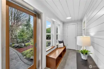 This entry is perfect for NW living!  Enjoy a built-in bench for shoe storage and hooks for coats, along with a closet for storage.