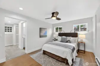 This main-level primary suite includes a beautiful bathroom, walk-in closet, and a door leading to the Zen-like backyard with a wonderful hot tub.  Your own private oasis!