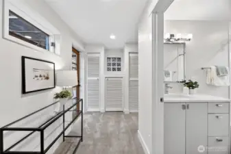The primary bathroom and closet space that continues around to the right of the frame.