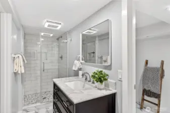 Enjoy this recently remodeled "jack-n-jill" bathroom on the lower level.  The fan/light are blue-tooth enabled and can change color.