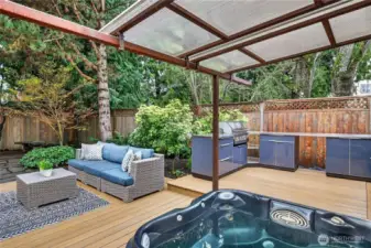 Step outdoors to your own private oasis!  The cover above the hot tub slides for more or less coverage from the elements.