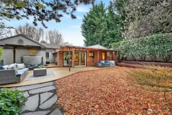 The backyard is fully-fenced with a tall solid metal gate to create complete privacy.