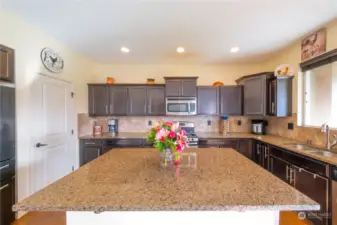 Granite countertops and ample cabinetry make cooking and entertaining effortless