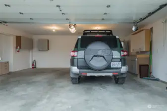 Oversized 528 sq ft garage with work benches and cabinetry