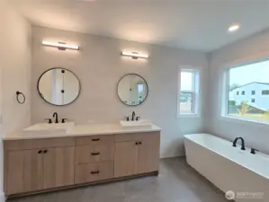 Double Vanity with Full Tile Wall and Designer Mirrors