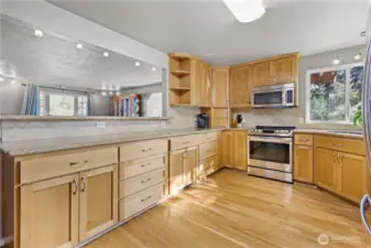 Expansive granite countertops offer generous space for baking, meal preparation, and effortless entertaining