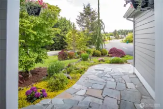 Flagstone entry way with gorgeous landscaping.