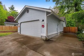 Two-car garage with a paved pad on the side-perfect for a boat, kayak, or RV. There's plenty of room to spread out. And don't miss the gate to backyard-great for privacy.