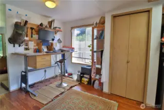 Dining area off of the kitchen currently used as an office .