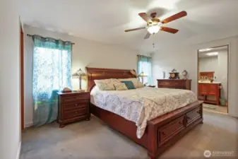 Main bedroom with king sized bed, walk in closet and private bathroom.