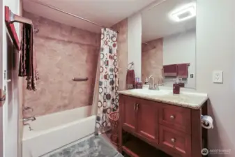 Primary bathroom includes closet for linens and storage.