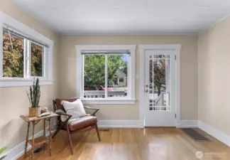 Corner livingroom windows looking out over the front porch