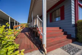 Ramp and stairs lead to front door.