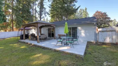 Large patio with cover has large space both covered and uncovered for year round enjoyment