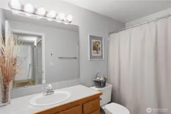 Full hallway bath with a shower tub combo. Conveniently located near the secondary bedrooms.